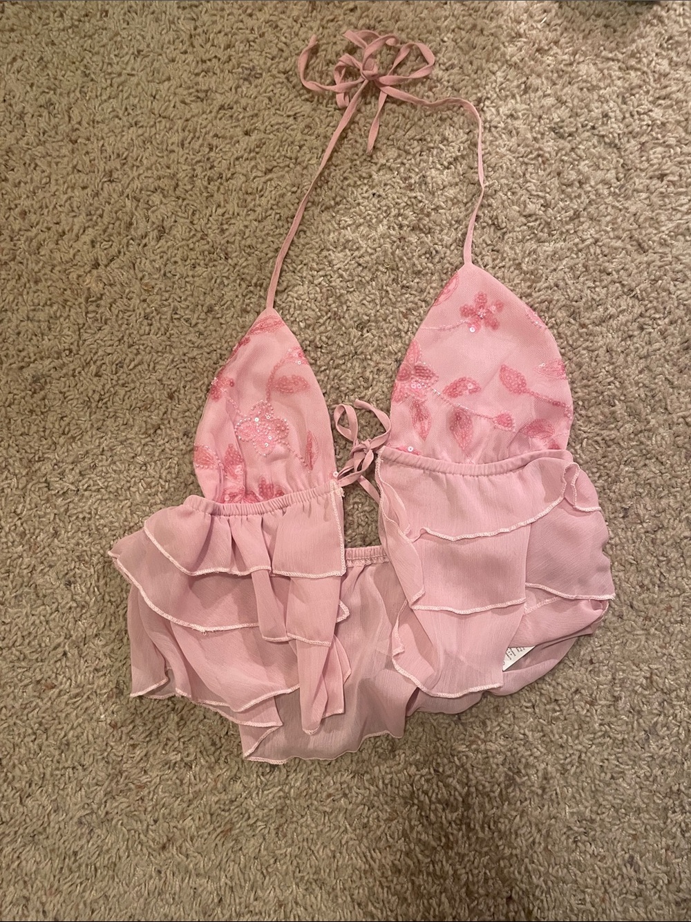 A tie top with one in the front and around the neck with an open back
